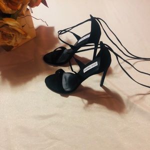 Steve Madden black open toe strap shoes.